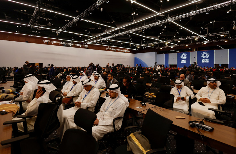  Participants attend the COP27 climate summit in Egypt's Red Sea resort of Sharm el-Sheikh, Egypt November 8, 2022.  (photo credit: MOHAMMED SALEM/REUTERS)