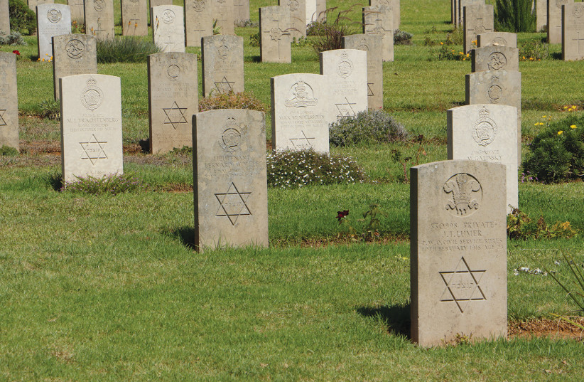  GRAVES OF Jewish soldiers in the cemetery.  (credit: RICHARD SHAVEI-TZION)