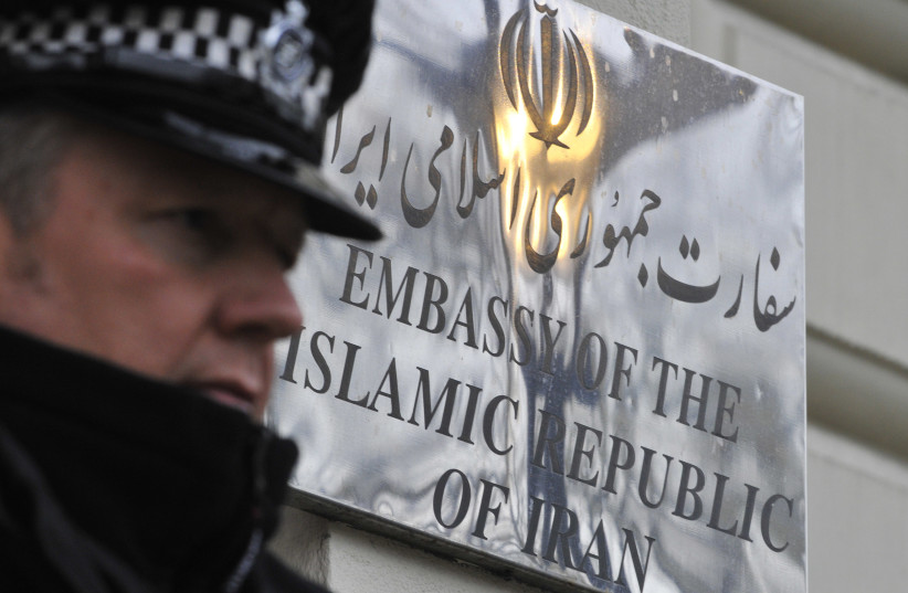  A police officer stands on duty outside the Iranian embassy in Kensington, central London December 2, 2011. (photo credit: TOBY MELVILLE/REUTERS)