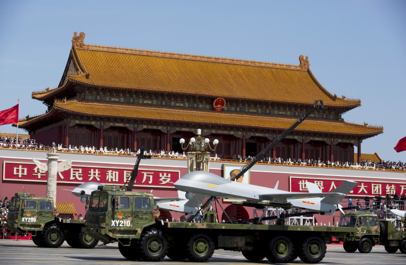  Military vehicles carrying Wing Loong, a Chinese-made medium altitude long endurance unmanned aerial vehicle, travel past Tiananmen Gate during a military parade to commemorate the 70th anniversary of the end of World War II in Beijing (photo credit: REUTERS)