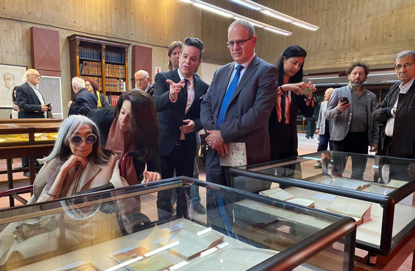  Borges' widow, Maria Kodama, on left, and Israel's ambassador to Argentina, Eyal Sela, in blue tie, visit the exhibit. (credit: Courtesy of the National Library of Argentina)
