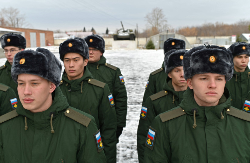  Russian conscripts called up for military service during the annual autumn draft line up at a gathering point before their departure for garrisons, in Omsk, Russia November 10, 2022 (credit: REUTERS/ALEXEY MALGAVKO)