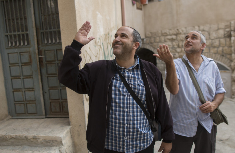  Jerusalem City Council member Aryeh King walks in the east Jerusalem neighborhood of Silwan, in Jerusalem on October 22, 2014,  (credit: YONATAN SINDEL/FLASH90)