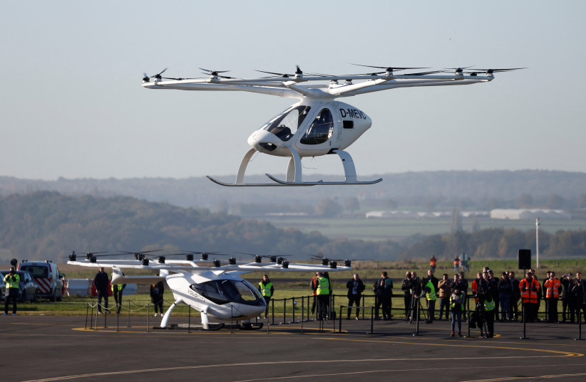 A Volocopter 2X drone taxi performs an integrated flight in conventional air traffic at Pontoise airfield in Cormeilles-en-Vexin, near Paris, France, November 10, 2022 (photo credit: BENOIT TESSIER/REUTERS)
