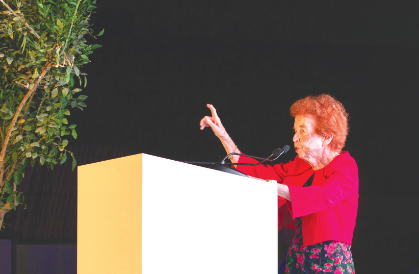  HOLOCAUST SURVIVOR Eve Kugler speaks at the main ceremony at the Crossroads of Civilizations Museum in Dubai. (credit: Exceed2/March of the Living)