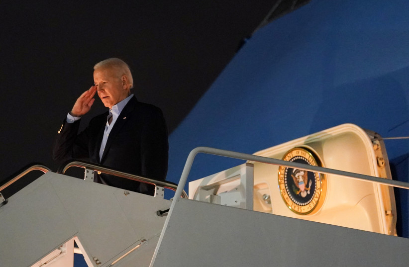 US President Joe Biden salutes from Air Force One as he departs for Egypt to attend the COP27 summit from Joint Base Andrews in Maryland, US, November 10, 2022. (photo credit: REUTERS/KEVIN LAMARQUE)