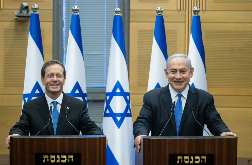  Newly elected Israeli president  Isaac Herzog with Israeli Prime Minister Benjamin Netanyahu in the Israeli pariament on the day of the presidential elections,  in Jerusalem, June 2, 2021. (photo credit: YONATAN SINDEL/FLASH90)