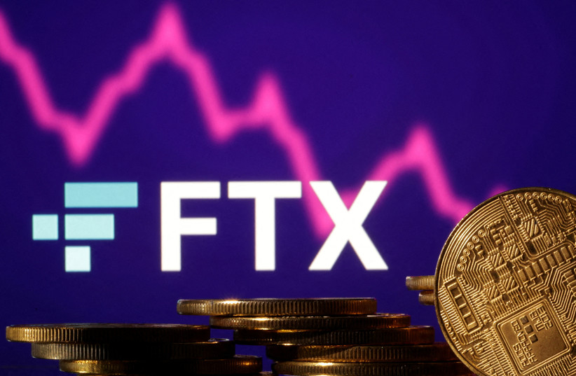  Representations of cryptocurrencies are seen in front of displayed FTX logo and decreasing stock graph (photo credit: REUTERS)