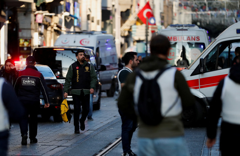  People react after an explosion on busy pedestrian Istiklal street in Istanbul, Turkey, November 13, 2022 (photo credit: REUTERS/KEMAL ASLAN)