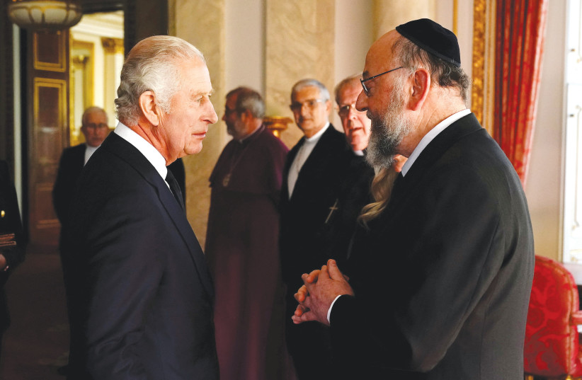  KING CHARLES III speaks to Chief Rabbi Ephraim Mirvis as he meets with faith leaders during a reception at Buckingham Palace, in September. Mirvis says many of his own meetings with religious leaders around the world happen only on condition of secrecy and even then are canceled at the last minute. (photo credit: Aaron Chown/Reuters)