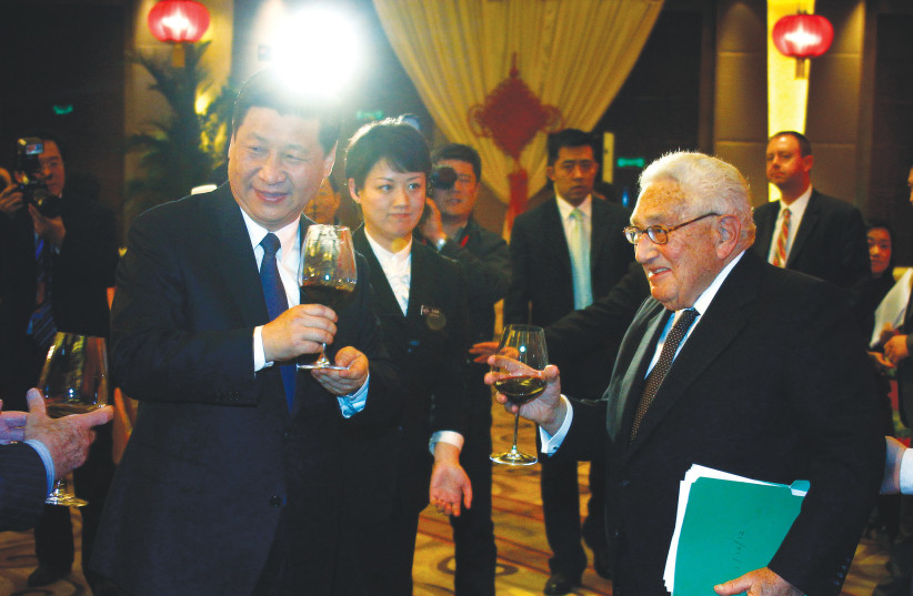  FORMER US secretary of state Henry Kissinger shares a toast with Xi Jinping, then China’s vice president, in Beijing in 2012, marking the 40th anniversary of US president Richard Nixon’s historic visit to China. (photo credit: David Gray/Reuters)