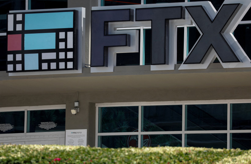   The logo of FTX is seen at the entrance of the FTX Arena in Miami, Florida, US, November 12, 2022. (credit: REUTERS/Marco Bello/File Photo)