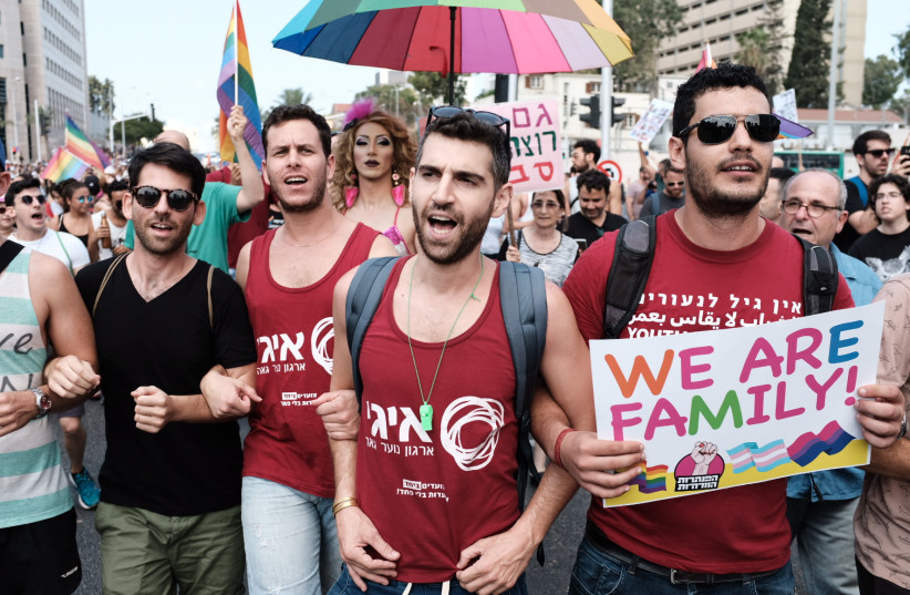  Members of the LGBTQ community and supporters participate in a demonstration against a Knesset bill amendment denying surrogacy for same-sex couples, in Tel Aviv, July 22, 2018. (photo credit: TOMER NEUBERG/FLASH90)