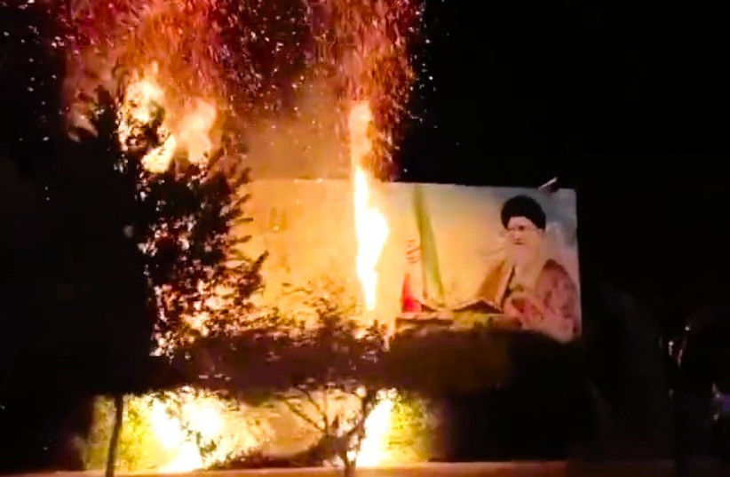  Billboard featuring Iranian Supreme Leader Ali Khamenei torched in southern Iran, November 14, 2022 (credit: 1500tasvir)
