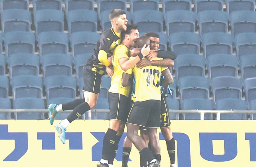  BEITAR JERUSALEM teammates celebrate after Danilo Asprilla (70) scored his second goal of the match to give the club a 2-1 victory over Bnei Sakhnin in the capital (photo credit: DANNY MARON)