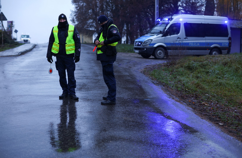  Police officers stand at a blockade after an explosion in Przewodow, a village in eastern Poland near the border with Ukraine, November 16, 2022. (photo credit: REUTERS/KACPER PEMPEL)