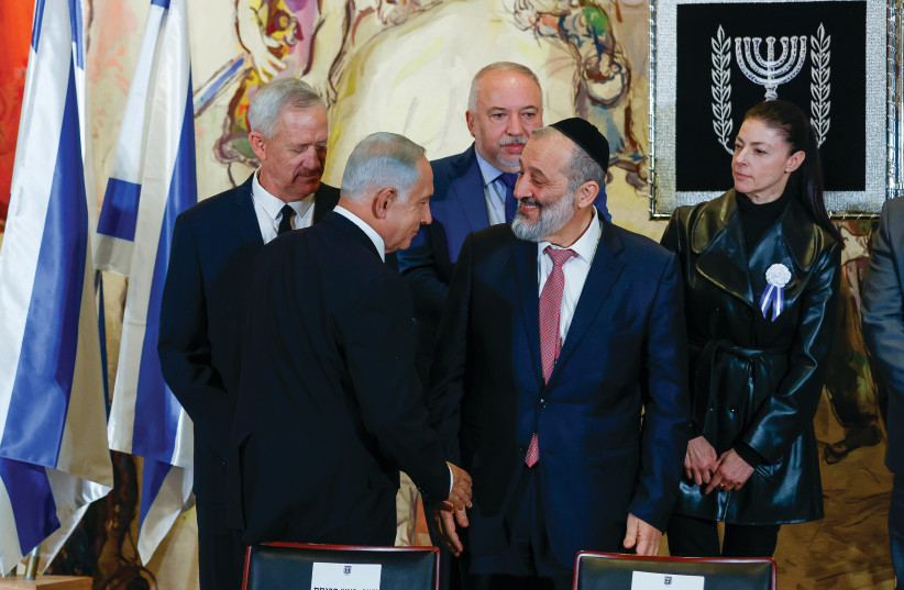  BENJAMIN NETANYAHU and Arye Deri – expected to soon become coalition partners – shake hands in the Knesset on Tuesday as current cabinet ministers Benny Gantz, Avigdor Liberman and Merav Michaeli look on. The new government will confiscate more Palestinian land, says the writer (credit: OLIVIER FITOUSSI/FLASH90)