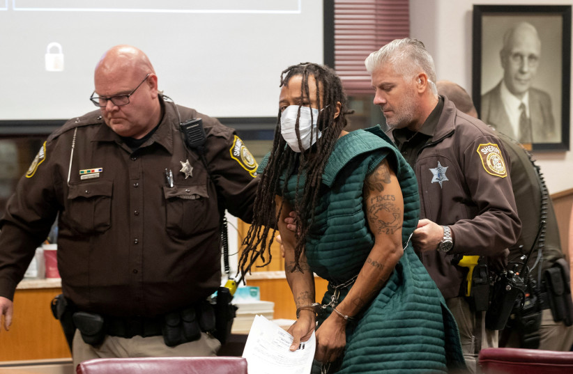 Darrell Brooks, charged with killing five people and injuring nearly 50 after plowing through a Christmas parade with his sport utility vehicle on November 21, appears in Waukesha County Court in Waukesha, Wisconsin, US November 23, 2021. (photo credit: Mark Hoffman/Pool via REUTERS/File Photo)