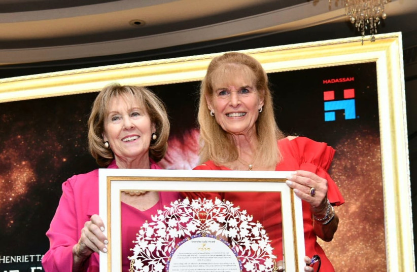  Ellen Hershkin (R), the immediate past president of Hadassah, presents the Henrietta Szold Lifetime Achievement Award to former Hadassah president Marlene Post (L), in Jerusalem, Israel on Nov. 16, 2022. (photo credit: Courtesy)