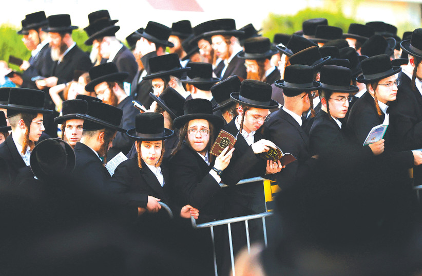  ULTRA-ORTHODOX Jewish men and children in Netanya.  (photo credit: JACK GUEZ/AFP VIA GETTY IMAGES)