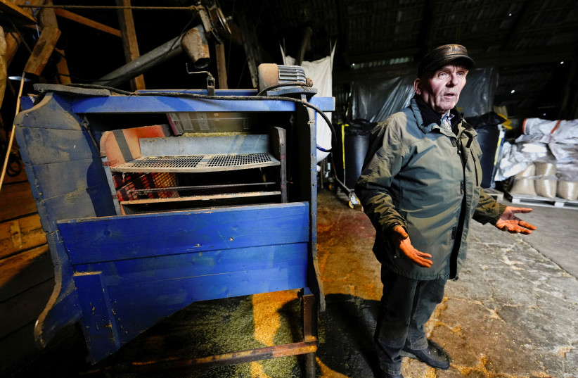  Lithuanian farmer Petras Vaitelis prepares oat and wheat grains to heat his house in Azuolaiciai, Lithuania November 14, 2022. (credit: INTS KALNINS / REUTERS)