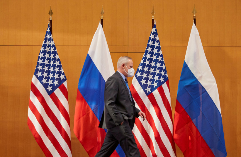 Russian and US flags are pictured before talks between Russian Deputy Foreign Minister Sergei Ryabkov and US Deputy Secretary of State Wendy Sherman at the United States Mission in Geneva, Switzerland January 10, 2022.  (credit: REUTERS/DENIS BALIBOUSE/FILE PHOTO)