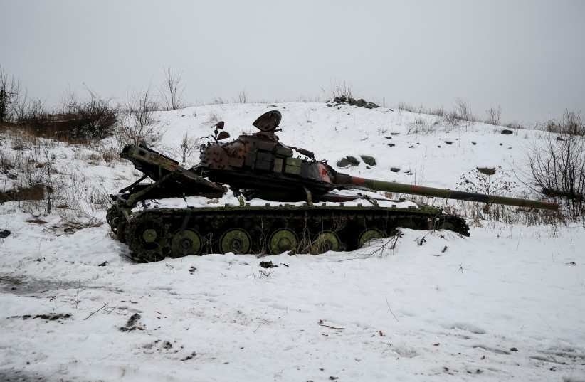  A destroyed Ukrainian tank is pictured on the front line near the industrial town of Avdiyivka, Ukraine February 4, 2017. (photo credit: REUTERS/GLEB GARANICH)