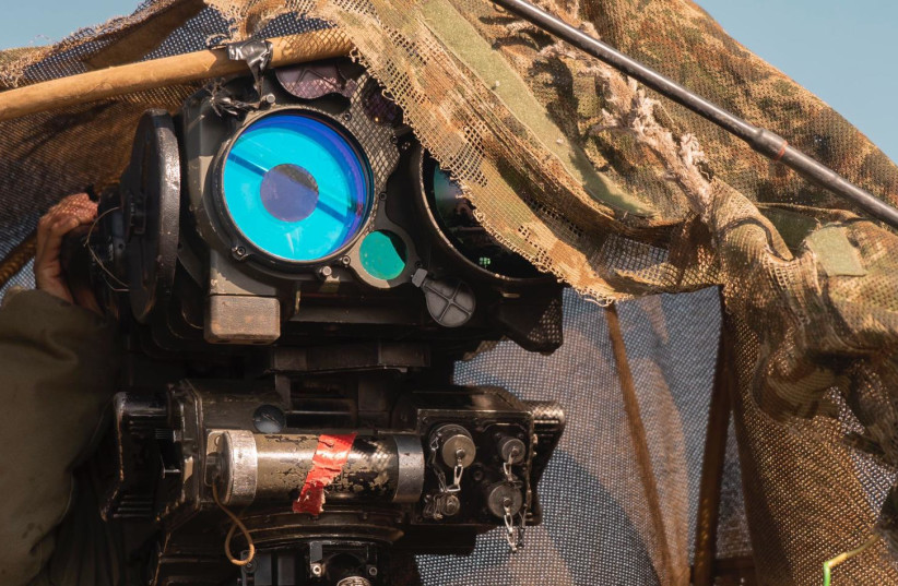 An IDF soldier monitors with an optical device. (credit: IDF SPOKESPERSON'S UNIT)