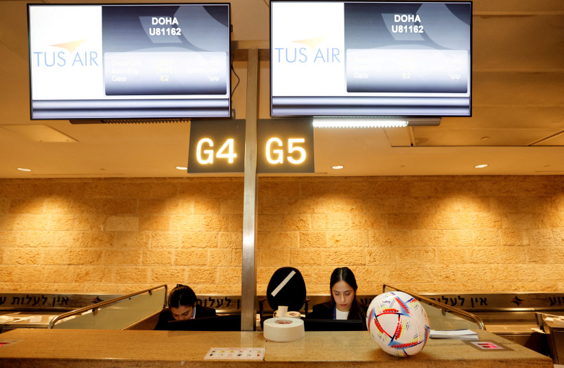 A soccer ball is seen on the check-in desk before the first direct commercial flight between Israel and Qatar for the 2022 FIFA World Cup Qatar, at Ben Gurion International Airport, near Tel Aviv, Israel, November 20, 2022. (credit: REUTERS/AMIR COHEN)