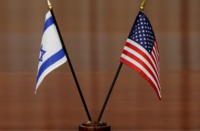  The flags of Israel and the US are seen at a table during a meeting between officials from the two countries. (photo credit: REUTERS/KEN CEDENO)