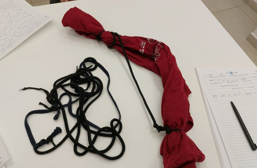  The rope and a t-shirt used by four girls to tie their counselor up before escaping their dorm. (credit: ISRAEL POLICE SPOKESPERSON'S UNIT)
