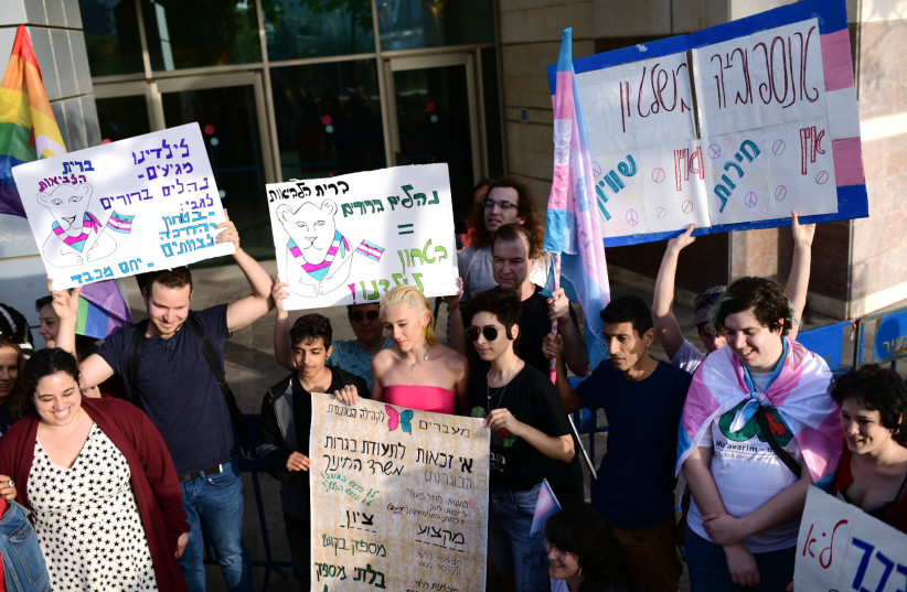  Israelis attend a demonstration in support of an Israeli transgender girl who was attacked at her school, outside the Education Ministry office in Tel Aviv, on April 28, 2019. (credit: TOMER NEUBERG/FLASH90)