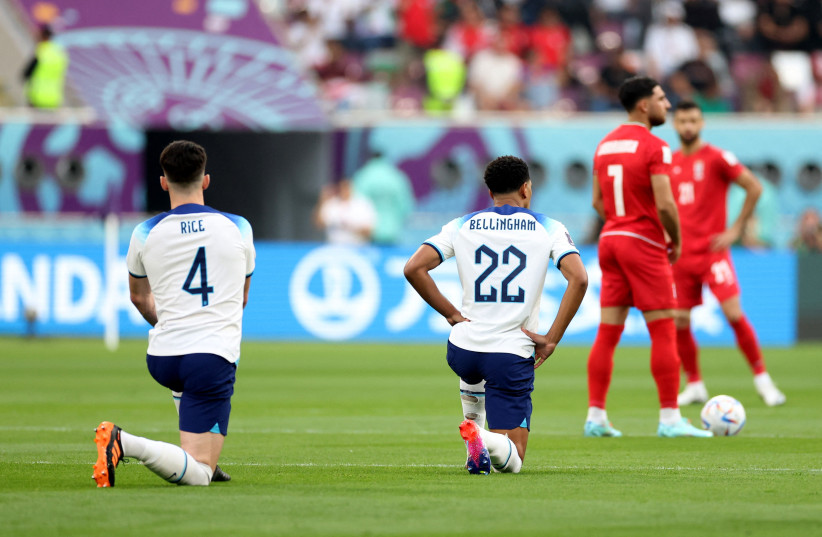  England's Declan Rice and Jude Bellingham take a knee before the match against Iran, FIFA World Cup in Khalifa International Stadium, Doha, Qatar on November 21, 2022 (credit: REUTERS/CARL RECINE)