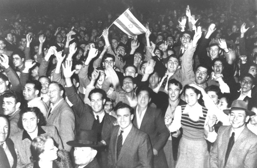  CELEBRATIONS TAKE place in the streets of Tel Aviv moments after the UN voted to pave the way for the creation of Israel, on November 29, 1947 (photo credit: REUTERS)