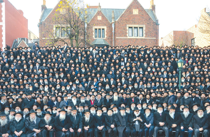  RABBIS GATHER to pose for a group photo in front of the Chabad Lubavitch World Headquarters in Brooklyn, on Sunday. A Lubavitcher Hassid in Brooklyn has no control over the policy decisions of the Israeli government (photo credit: David Dee Delgado/Reuters)