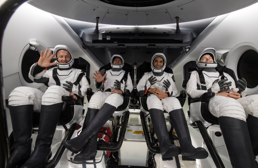 European Space Agency (ESA) astronauts pictured inside the SpaceX Crew Dragon Endurance spacecraft onboard the SpaceX Shannon recovery ship shortly after having landed in the Gulf of Mexico, off the coast of Tampa, Florida, US, May 6, 2022 (photo credit: NASA/AUBREY GEMIGNANI/HANDOUT VIA REUTERS)