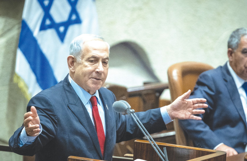  BENJAMIN NETANYAHU addresses the Knesset, on Monday. He will be caught between his far-Right allies and their demand to advance sovereignty over the West Bank and Israel’s desire to expand regional peace and integration, says the writer (photo credit: YONATAN SINDEL/FLASH90)