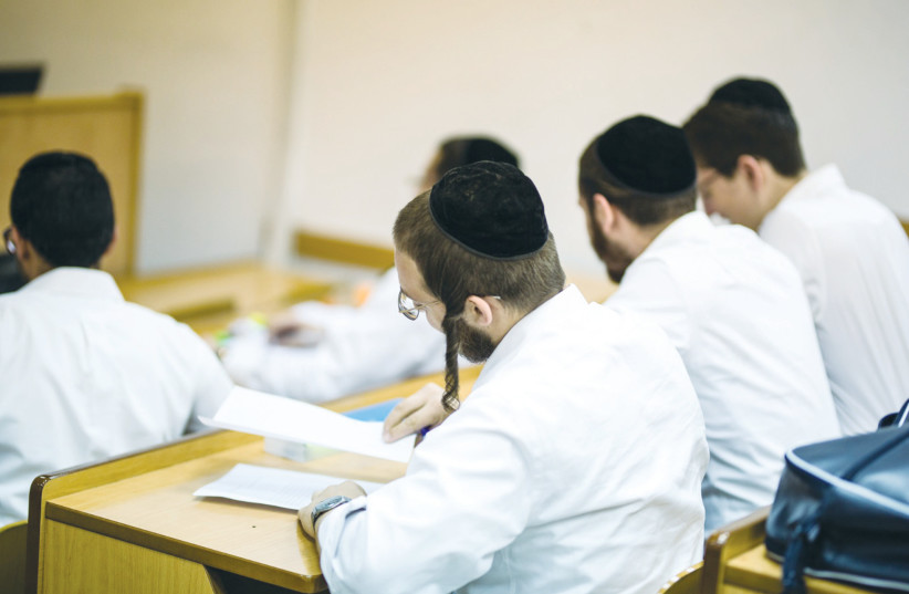 HAREDI STUDENTS attend a class at The Jerusalem College of Technology (photo credit: JCT)