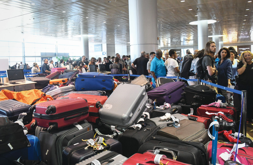  IS THE red samsonite among the pile of luggage at the airport? (photo credit: FLASH90)