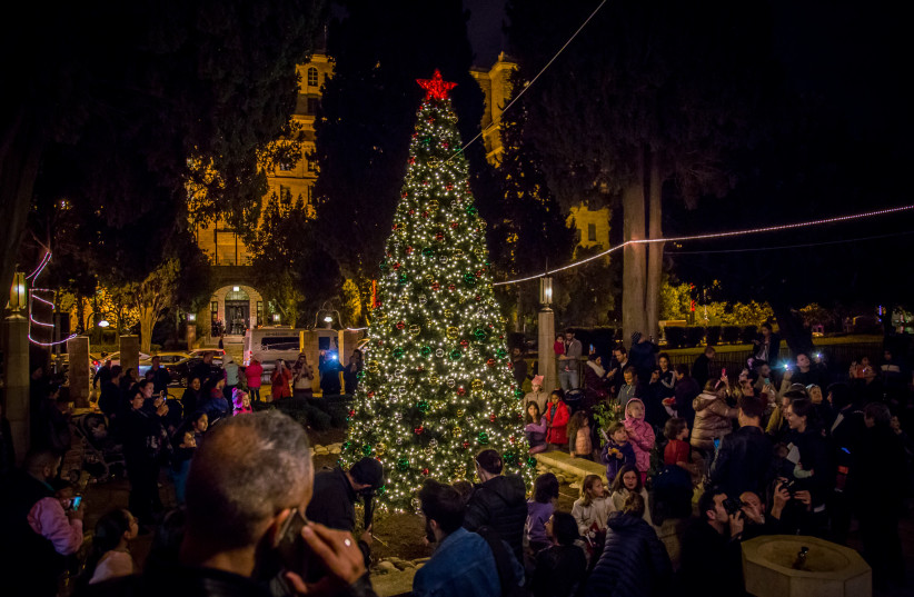  The YMCA Christmas tree lighting ceremony in Jerusalem. (credit: JERUSALEM INTERNATIONAL YMCA)