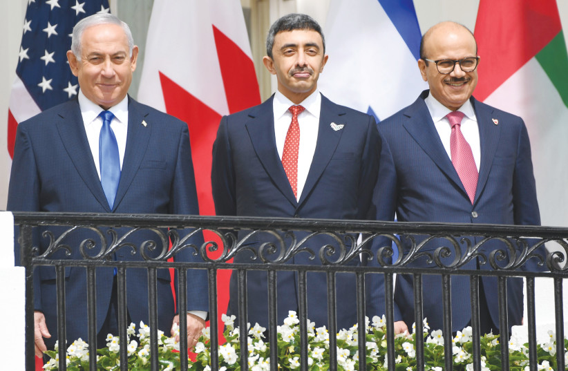  Benjamin Netanyahu, UAE Foreign Minister Abdullah bin Zayed Al-Nahyan and Bahrain Foreign Minister Abdullatif al-Zayani pose before they participate in the signing of the Abraham Accords at the White House in 2020. (photo credit: Saul Loeb/AFP via Getty Images)