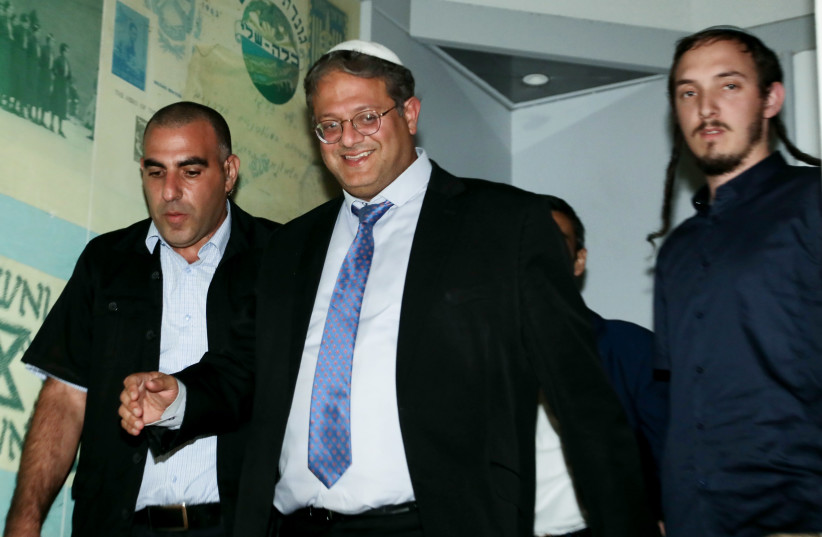 Hanamel Dorfman, seen to the left of Otzma Yehudit head Itamar Ben-Gvir in a photo taken in Tel Aviv on November 7, 2022 (photo credit: GIDEON MARKOWICZ/FLASH 90)
