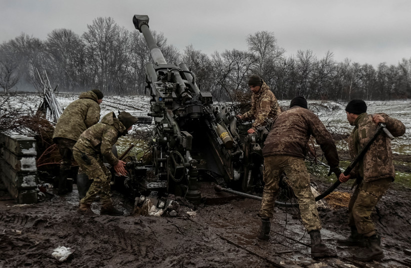 Ukrainian service members fire a shell from an M777 Howitzer at a front line, as Russia's attack on Ukraine continues, in Donetsk Region, Ukraine, November 23, 2022. (photo credit: RADIO FREE EUROPE/RADIO LIBERTY/SERHII NUZHNENKO VIA REUTERS)