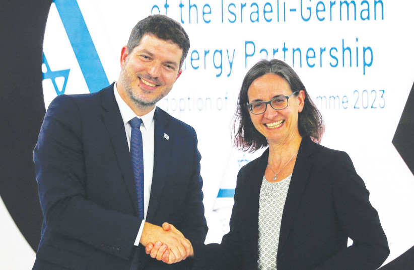  LIOR SCHILLAT, director-general of the Energy Ministry, shakes hands with Birgit Schwenk, director-general for climate action at the German Ministry for Economic Affairs and Climate Action, after signing a working plan for energy cooperation, at COP27 in Sharm e-Sheikh, earlier this month.  (photo credit: THAIER AL-SUDANI/REUTERS)