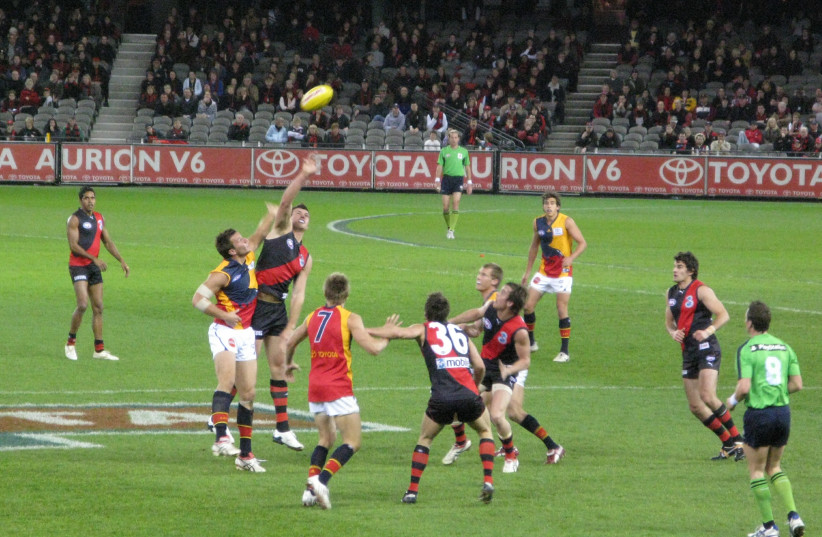  An AFL match between Essedon and Adelaide Football Clubs. (credit: MARK EHR via WIKIMEDIA COMMONS)