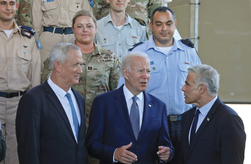  US PRESIDENT Joe Biden chats with Prime Minister Yair Lapid and Defense Minister Benny Gantz during the president’s visit to Israel, in July. (photo credit: Gil Cohen-Magen/Reuters)