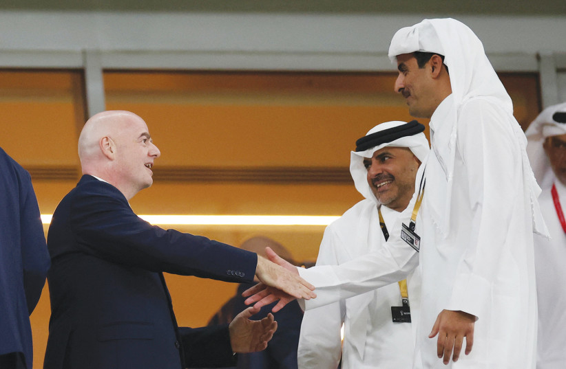  EMIR OF Qatar Sheikh Tamim bin Hamad Al Thani (right) and Prime Minister Khalid bin Khalifa bin Abdulaziz Al Thani meet FIFA president Gianni Infantino before a match at the World Cup tournament in Doha, on Monday.  (photo credit: PEDRO NUNES/REUTERS)