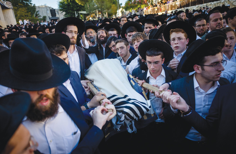  THE BODY of Aryeh Shechopek is carried at his funeral in Jerusalem, last Wednesday. (photo credit: YONATAN SINDEL/FLASH90)