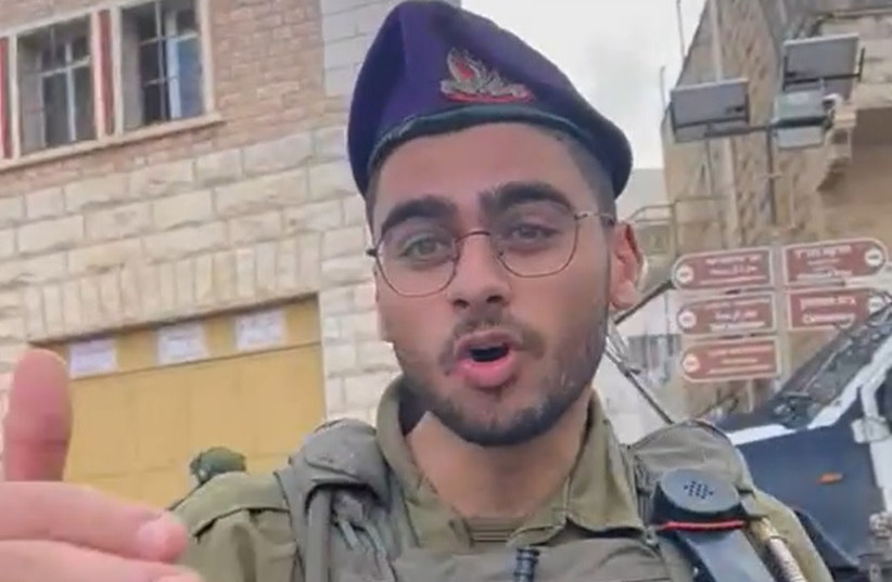 IDF soldier tells left-wing activist ''I decide what the law is,'' November 25, 2022. (credit: Issa Amro and Tal Sagi/Screenshot)