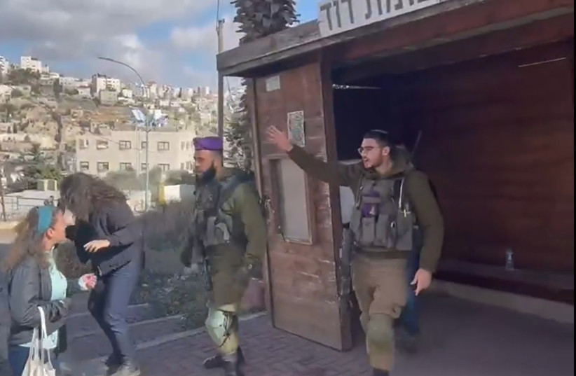  Soldiers confront left-wing activists in Hebron, November 25, 2022. (photo credit: Issa Amro and Tal Sagi/Screenshot)